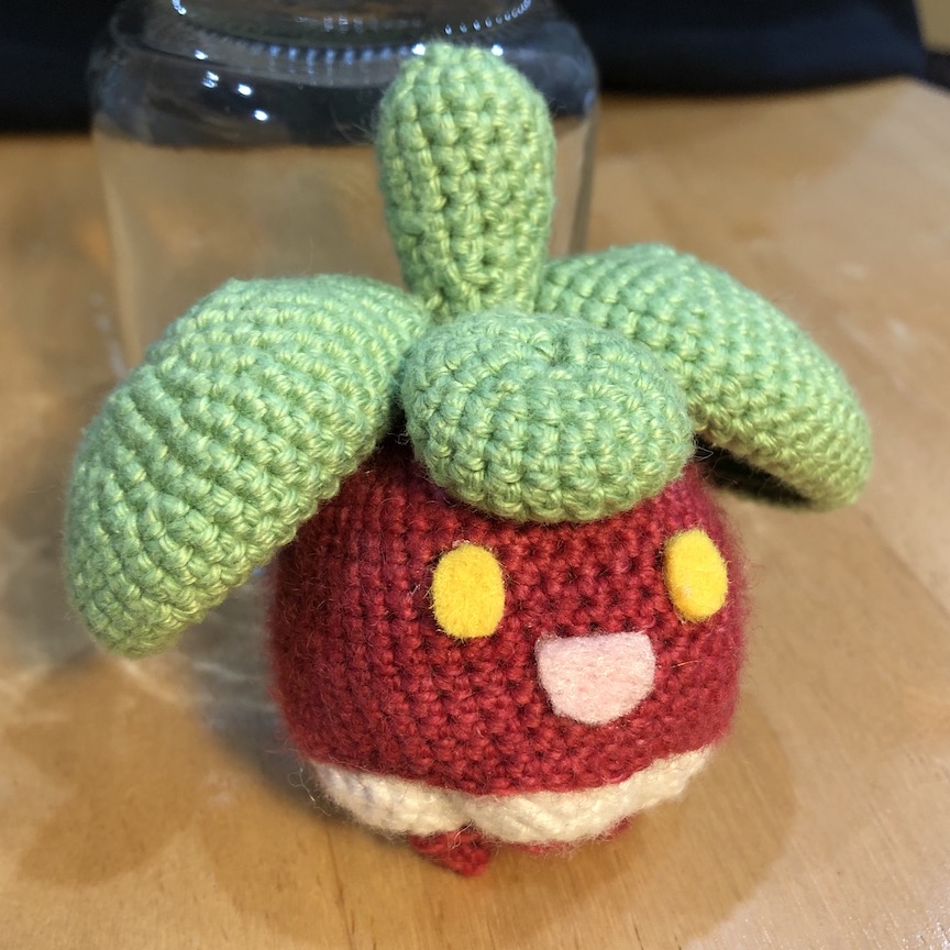 Crocheted bounsweet looking delighted