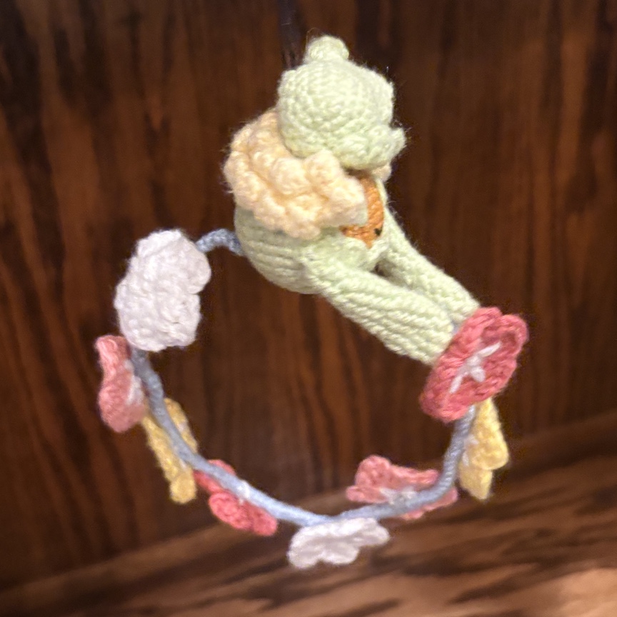 Crocheted comfey from the side to show off her flowers