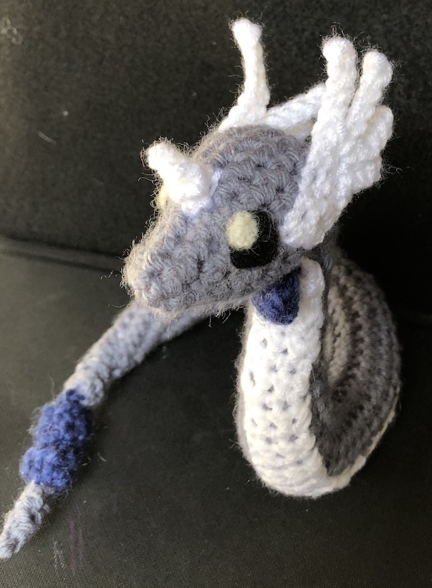 crocheted dragonair curled up