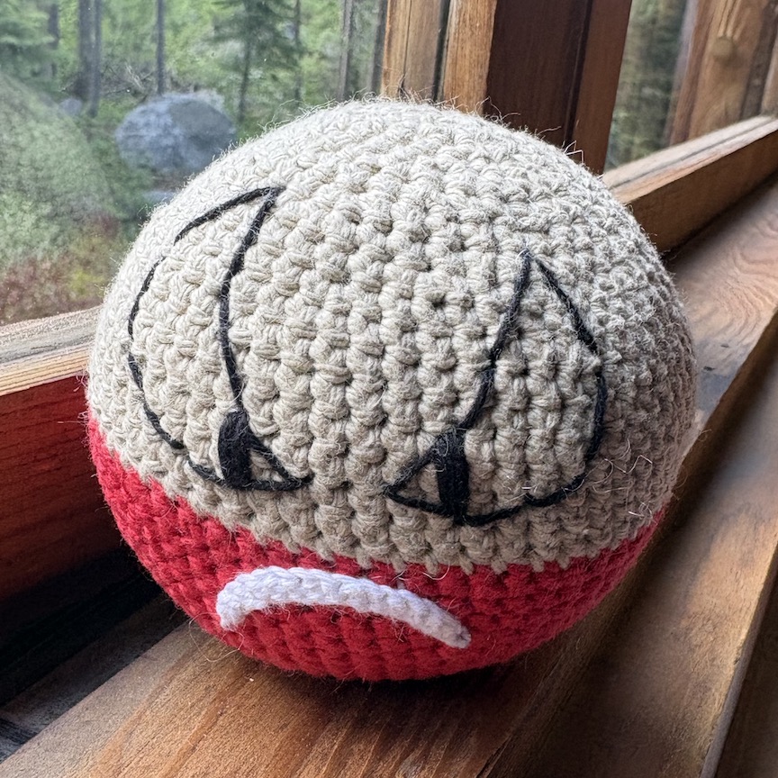 Crocheted Hisuian electrode, about the size of a softball
