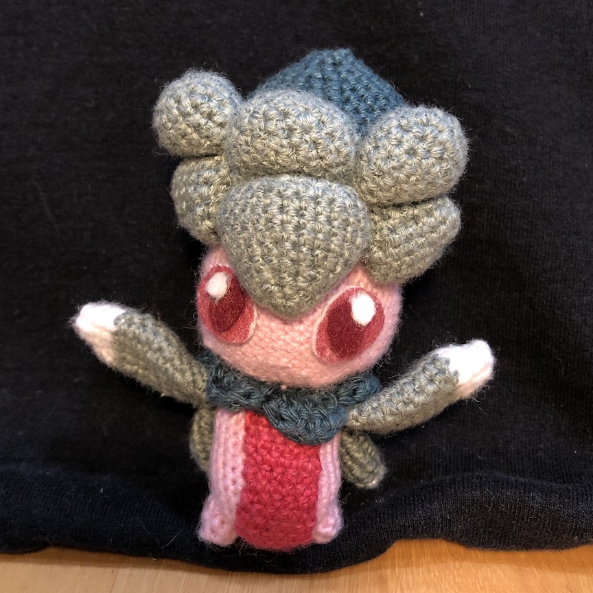 Crochet fomantis with its leaf arms in the air in joy