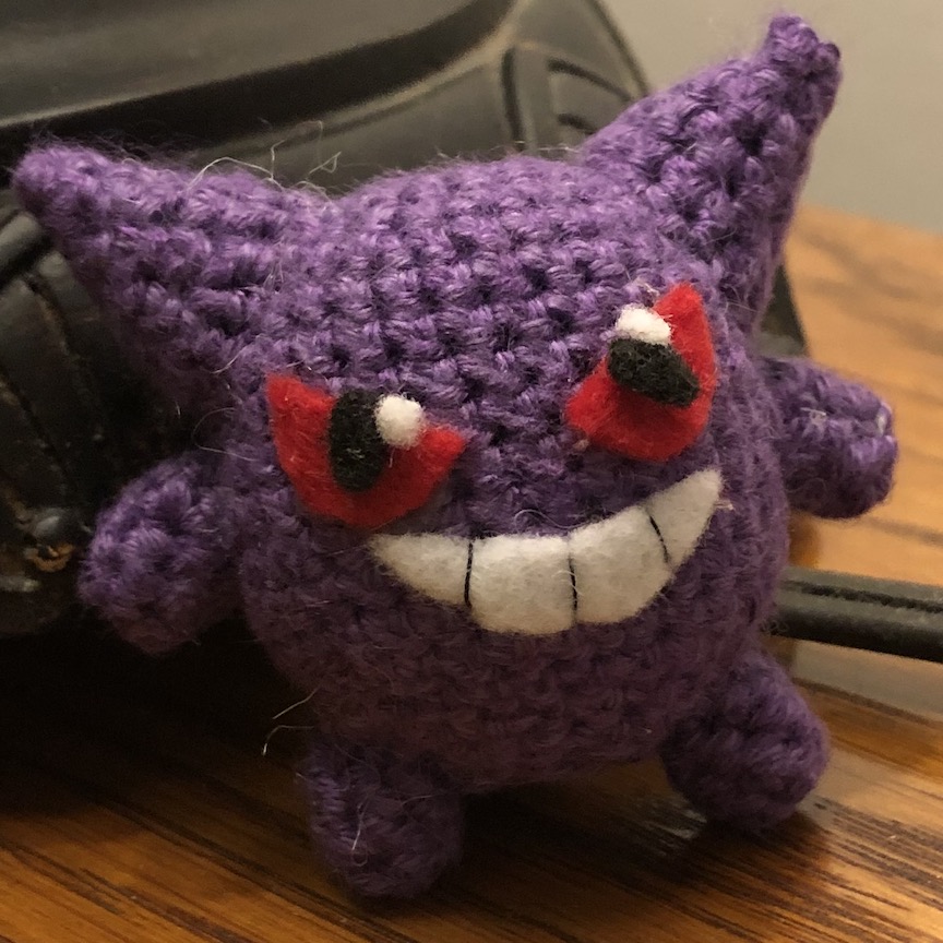Crocheted gengar with felt eyes and grin