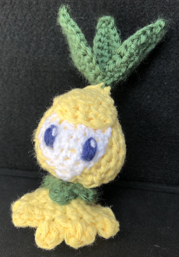 Shiny crocheted petilil from the front
