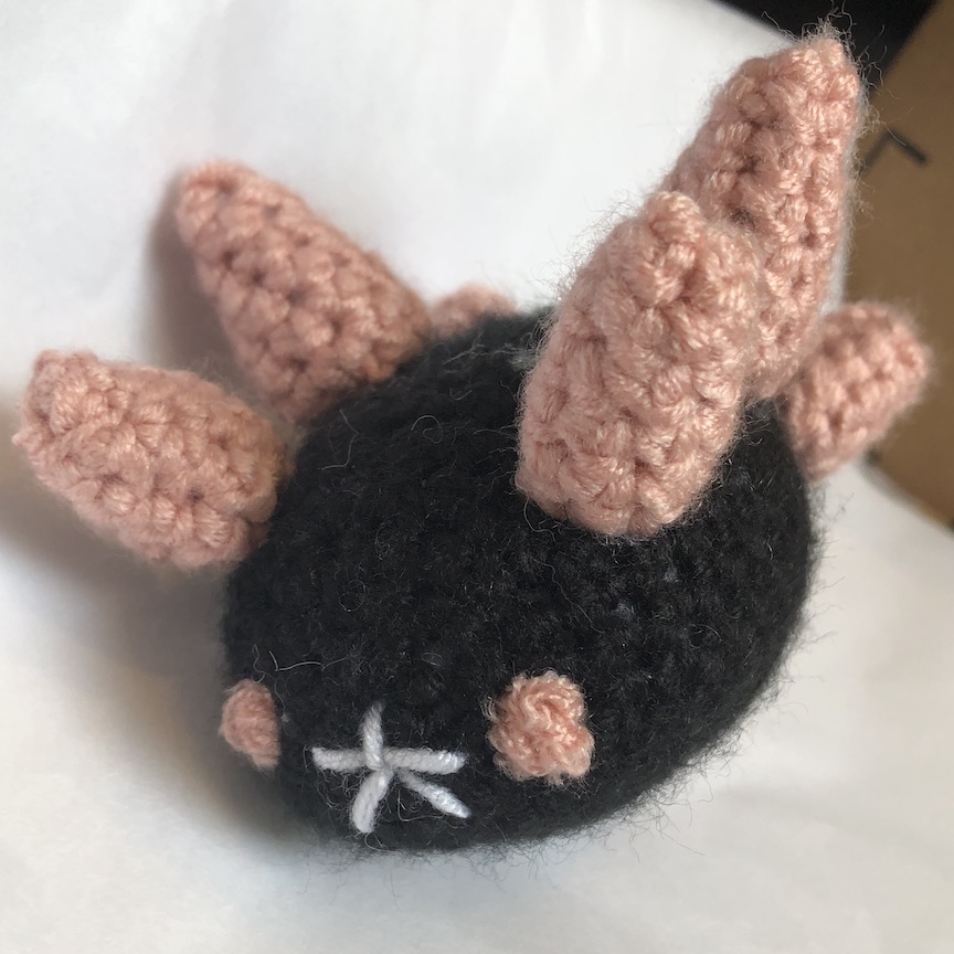 Crocheted pyukumuku with pale pink spikes
