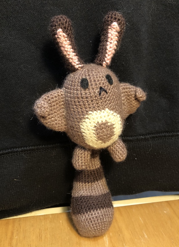 crocheted sentret standing tall on his tail