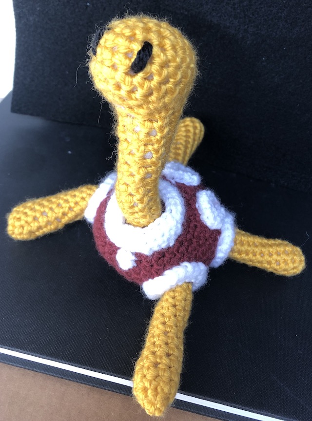 crocheted shuckle facing you at an angle
