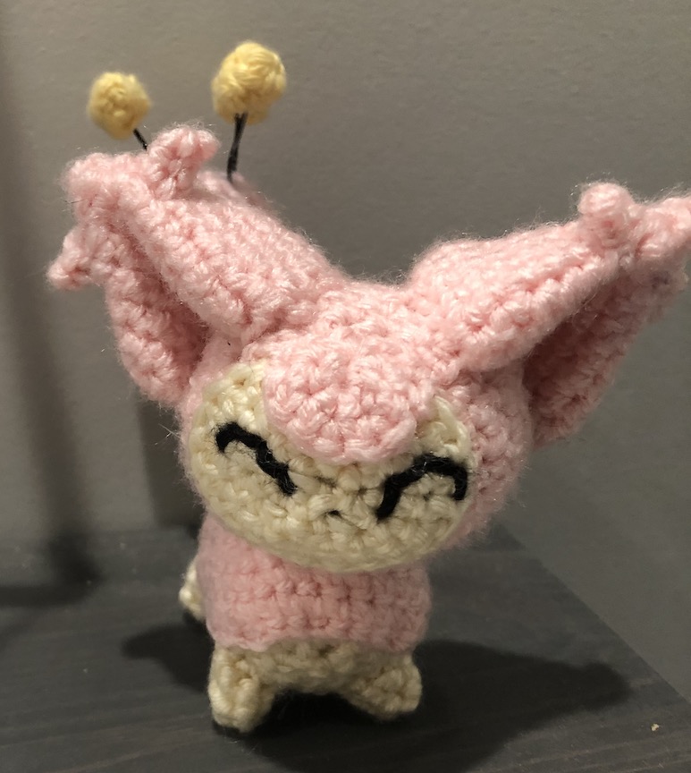 crocheted skitty facing you