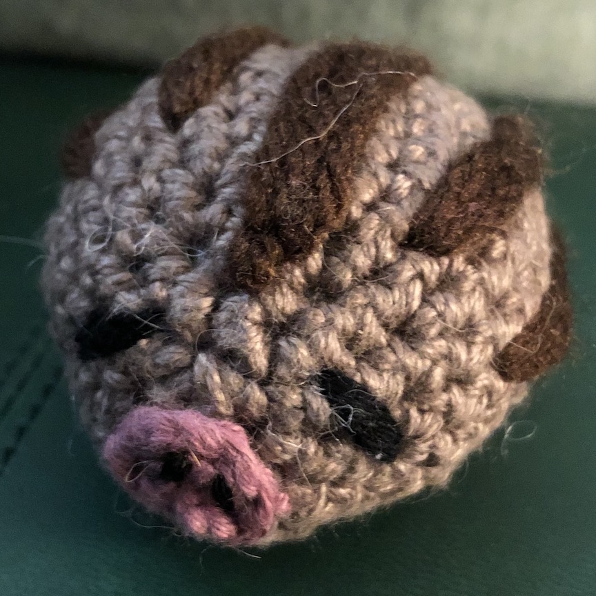 Small crocheted swinub with larger yarn facing you