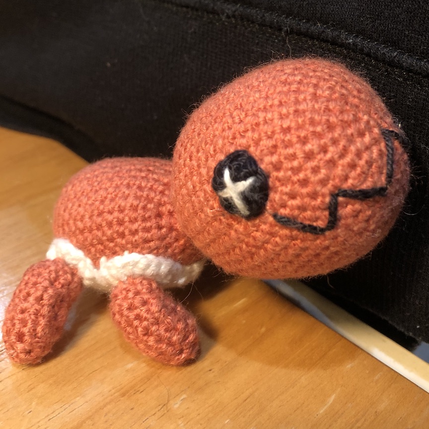 crocheted trapinch facing right and head held up