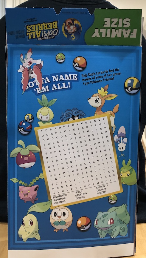 The back of the box, which features a word search for different grass type pokémon. Various grass-type pokémon (including those whose names appear in the word search) surround the word search. Lurantis is at the top with the instructions: Gotta name 'em all! Help Cap'n Lurantis find the names of some of her grass-type pokémon friends!