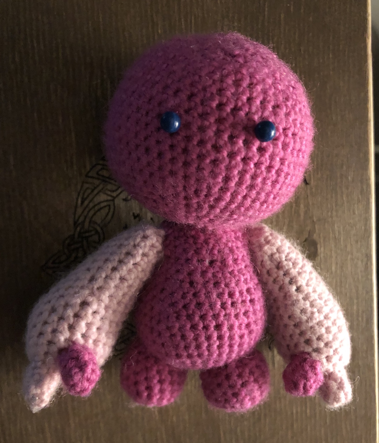 Crocheted head and body now with legs, arms, and fingers. Still pins for eyes