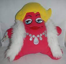 Pink plush star with a fluffy boa, blonde hair and a printed-on diamond necklace. Her eyes are hard plastic